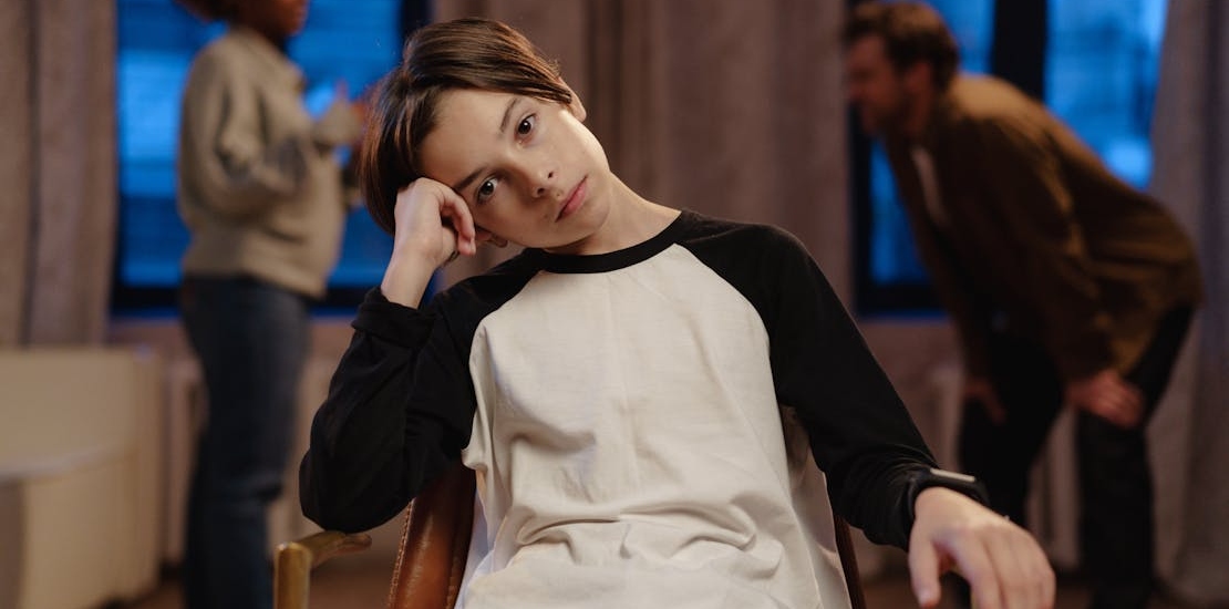 A Boy Sitting on a Chair