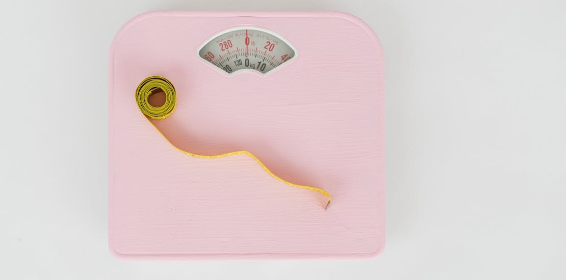 a Measuring Tape on a Weighing Scale